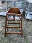 Winco Walnut Finish Wood High Chair W/ Safety Harness Strap Used. Price: $25.00.