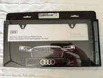 Brand New Box Authentic Audi Rings Black Stainless Steel License Plate Frame. Price: $60.00.