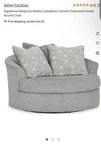 Signature Design By Ashley Casselbury Cement Oversized Swivel Accent Chair Used. Price: $350.00.