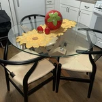 Poly & Bark Round Glass Dining Table + Weave Chairs Used. Price: $600.00.