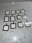 Pottery Barn Mini Frames Set Of 12 Good Condition With Hooks Missing New. Price: $20.00.