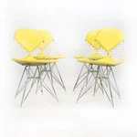 1958 Set Of Four Herman Miller Eames DKR-2 Wire Bikini Chairs Yellow Naugahyde Used. Price: $3800.00.